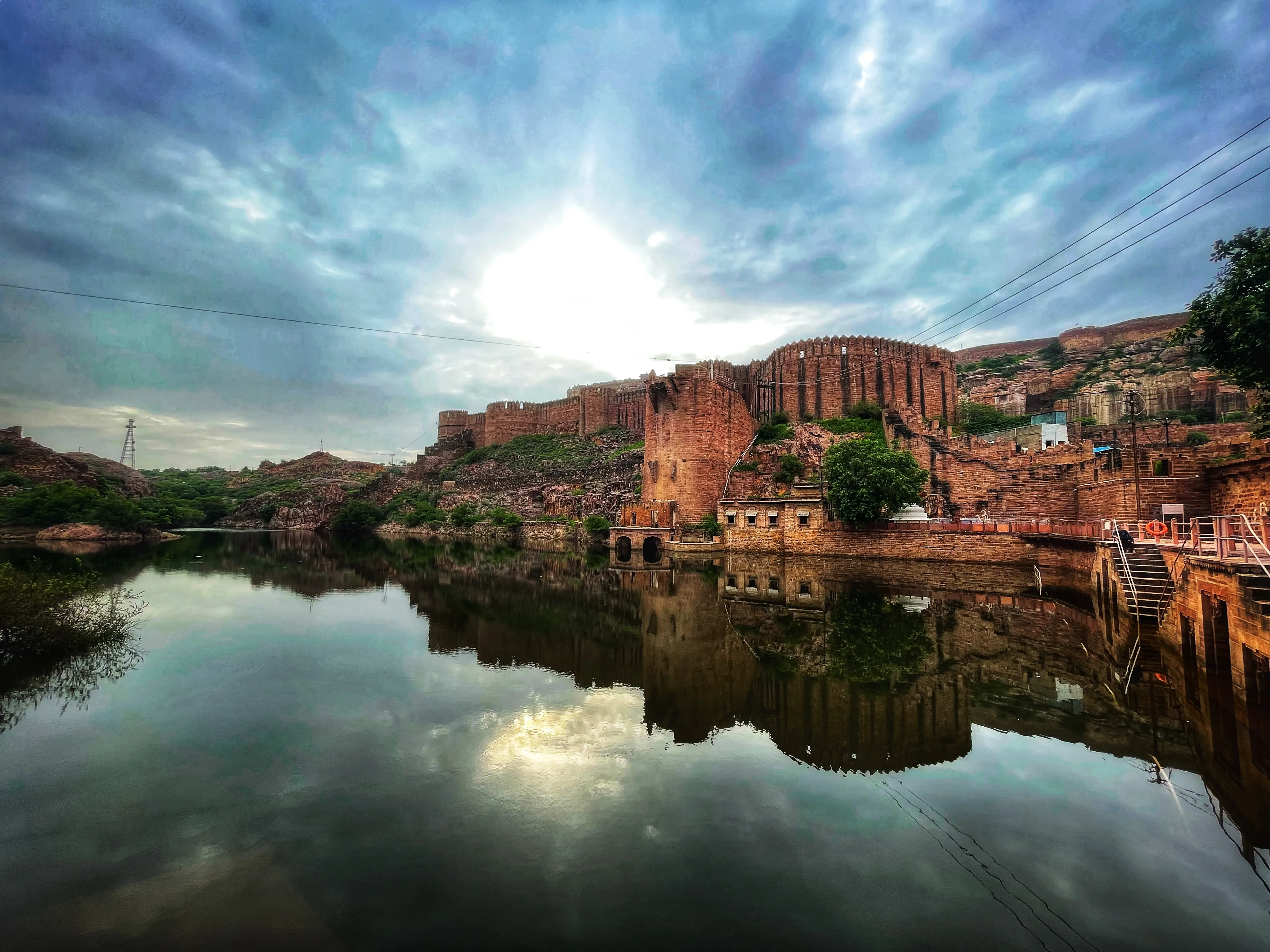 Narrow blue painted streets of Jodhpur city with sunlight filtering through